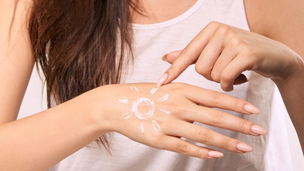 Best SPFs - woman with SPF on her hand