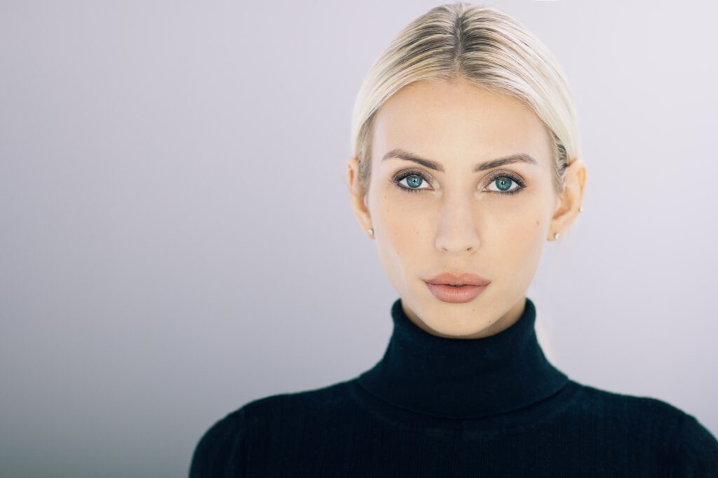 Attractive middle aged woman after her revision rhinoplasty in Palo Alto, CA