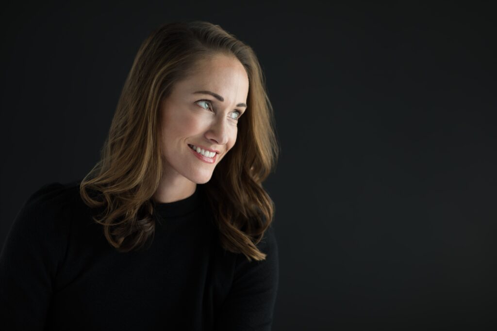 Attractive middle aged woman smiling after getting the best nose job in the Bay Area
