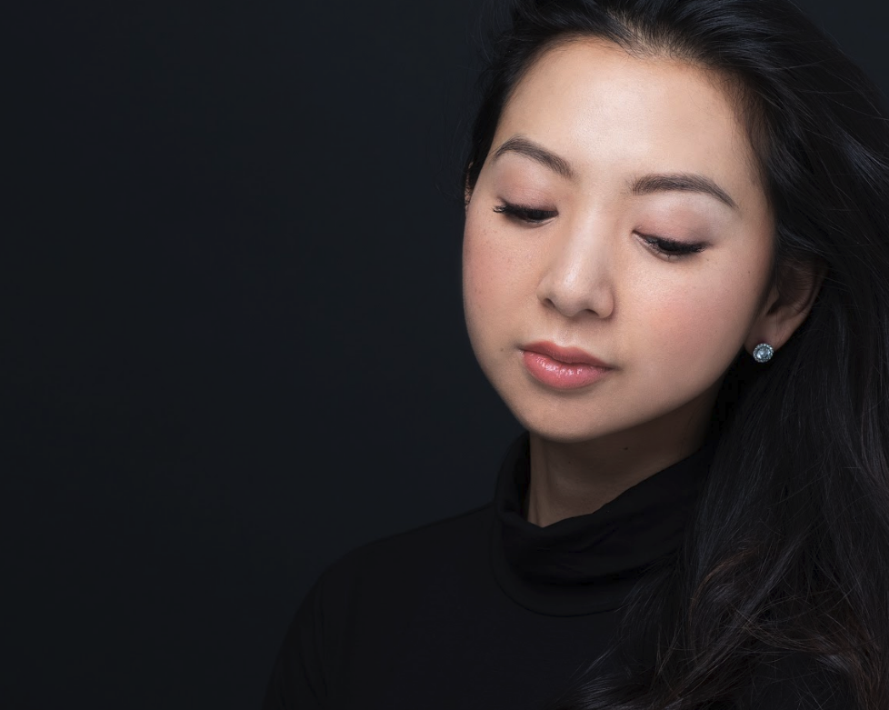 Beautiful young woman with eyes down