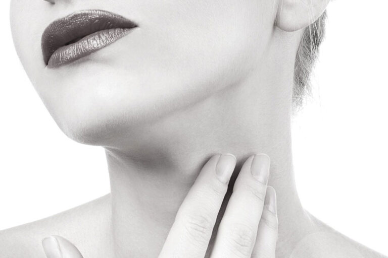 woman touching neck after Neck Treatment